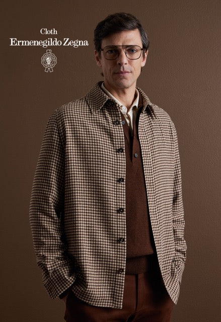Model wearing a brown and cream houndstooth overshirt over brown knitwear; Ermenegildo Zegna cloth reference 67046.