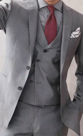 Marzoni light gray three-piece suit crafted from premium Italian fabric, highlighting sophisticated tailoring and classic styling for luxury custom clothing inspiration.