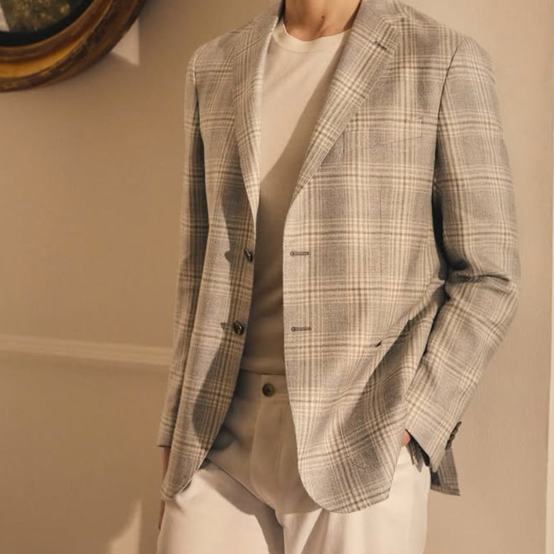 Scabal light gray plaid sport coat in premium Belgian fabric, showcasing contemporary tailoring, soft neutral tones, and timeless luxury menswear.