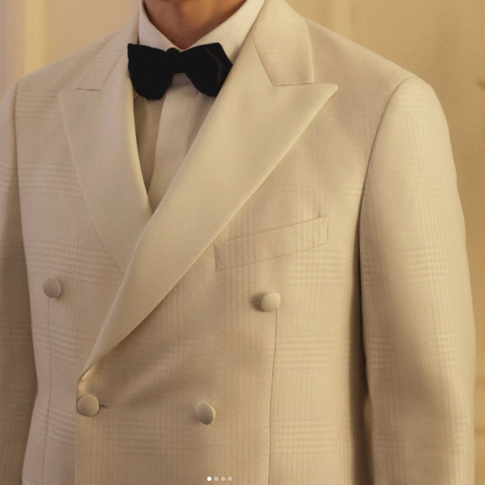 Scabal luxury white double-breasted tuxedo in premium Belgian fabric, showcasing elegant formal tailoring for weddings, galas, and black-tie events.