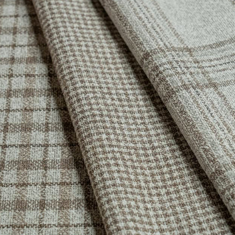 Assorted neutral wool fabrics from Vitale Barberis Canonico showcasing classic check and plaid patterns with refined Italian weaving and exceptional textile quality.