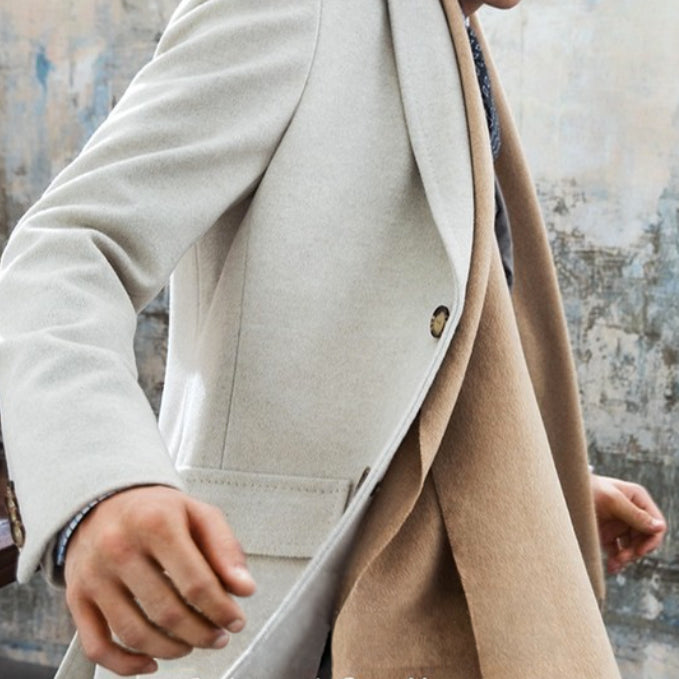 Detail of a Marzoni luxury wool overcoat featuring premium Italian fabric, elegant tailoring, and sophisticated layering for custom outerwear.