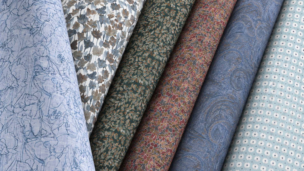 Stoffa Dobby Prints shirting samples with abstract, floral, paisley and small circular patterns in blue, green and rust.